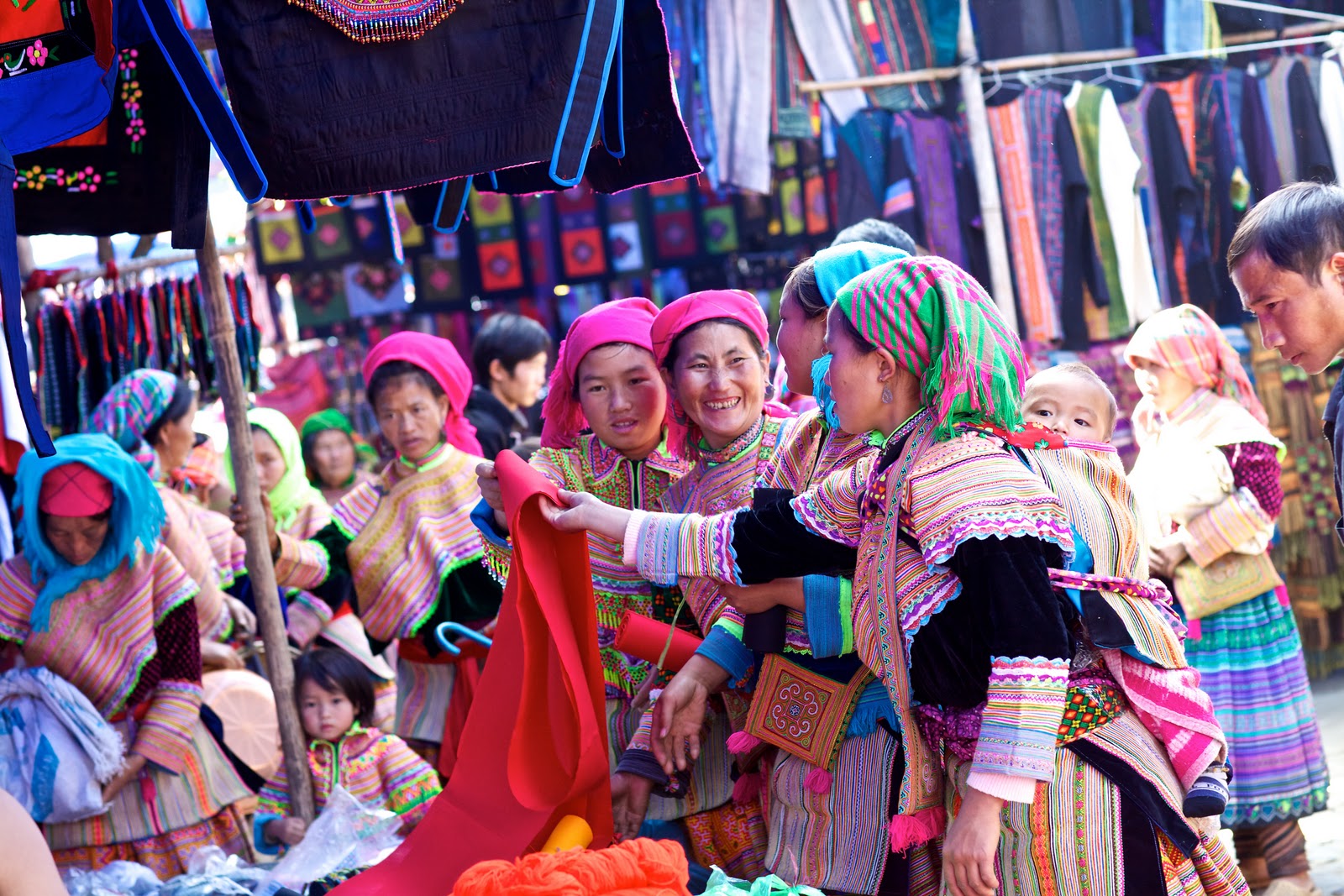 Holding an umbrella to go to Bac Ha market